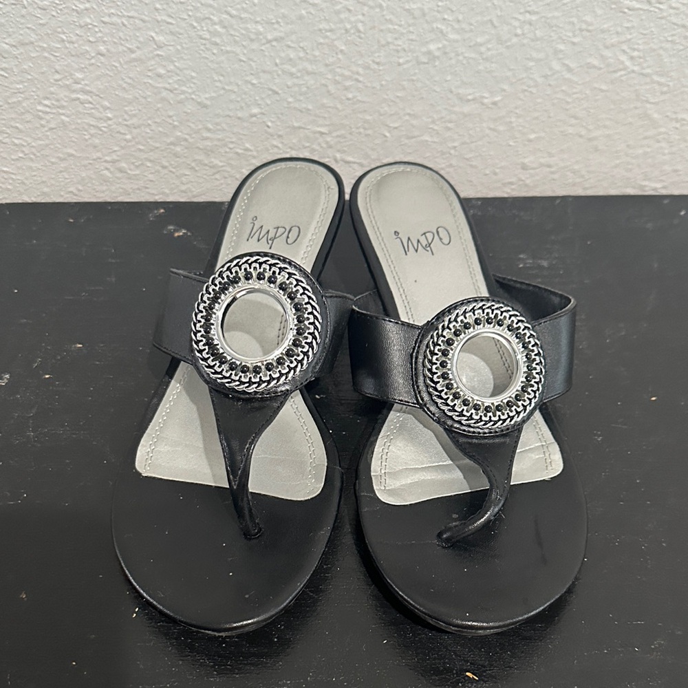 Impo Black Toe-Post Sandals with Decorative Silver Medallion